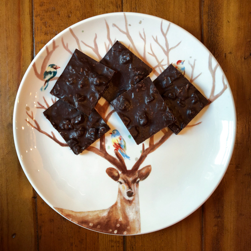 dark chocolate bark with apricots and coconut on a reindeer plate