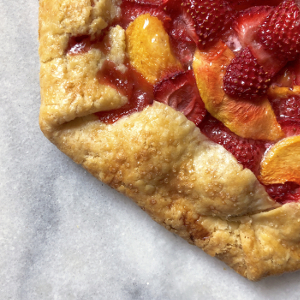Strawberry peach galette on counter