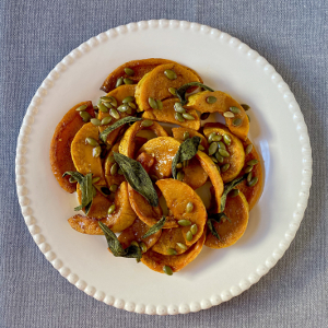 Roasted honeynut squash topped with sage and pepitas