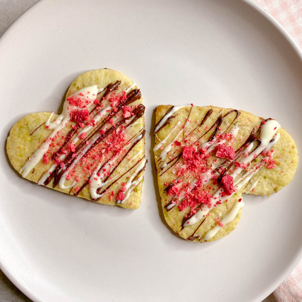 Heart shaped pistachio cookies with chocolate and strawberry