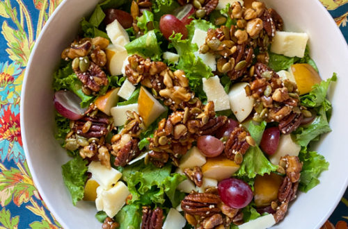 Autumn harvest salad with cheddar, grapes, pear and maple crunch topping