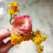 Tiny handheld bouquet of ranunculus and garden flowers
