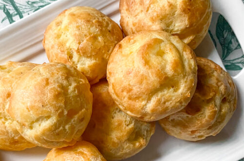 Cheddar and poarmesan gougeres on a plate
