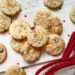 Cranberry shortbread cookies on a holiday plate with a red trimmed napkin